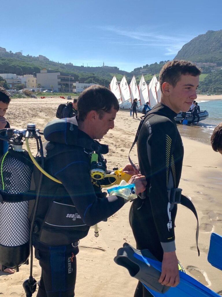 Instructor briefing a young diver on Dalia Beach